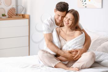 Morning of happy young couple in bed�