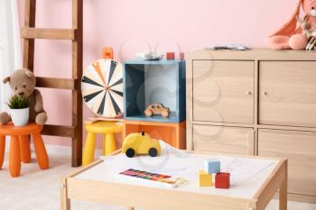 Stylish interior of modern playroom in kindergarten�