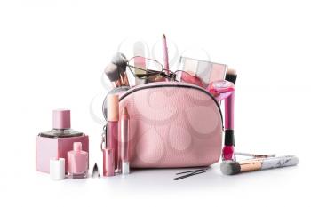 Makeup bag with decorative cosmetics and accessories on white background�