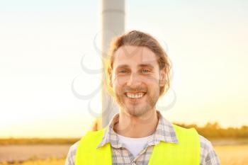 Male engineer on windmill farm for electric power production�