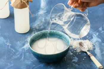Preparing of rice water on color background�