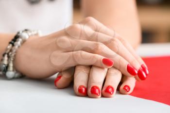 Hands with beautiful manicure on color background, closeup�