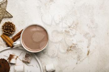 Cup of hot cacao drink with marshmallows on light background�