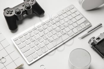 Computer keyboard and different modern devices on white background�