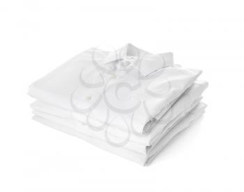 Stack of male shirts on white background�