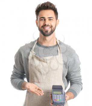 Young man with payment terminal on white background�