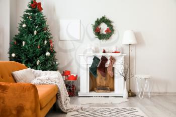 Interior of living room with fireplace decorated for Christmas�