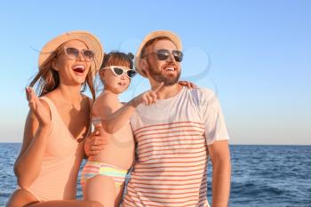 Happy family on sea beach�