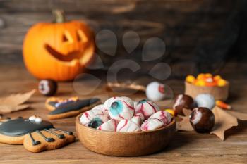 Tasty treats for Halloween on table�