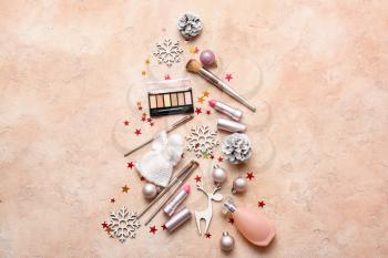 Christmas composition with cosmetics on color background�
