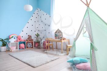 Interior of modern children's room with play tent�