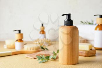 Bottle with natural shampoo on color background�