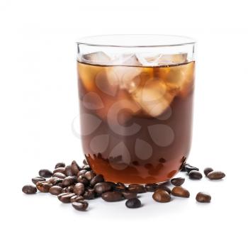 Glass of tasty cold brew and coffee beans on white background�