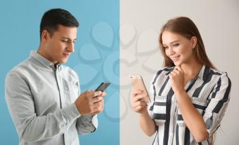 Young couple using mobile phones for online date�