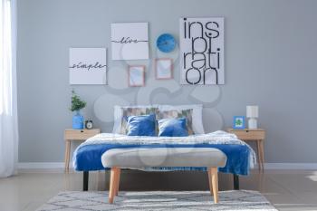 Stylish interior of bedroom in blue colors�
