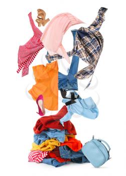 Many different clothes and shoes on white background�