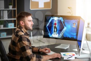 Male video games designer working in studio�