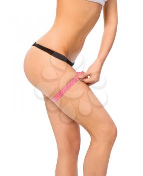Royalty Free Photo of a Woman Measuring Her Thigh