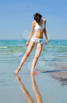 Royalty Free Photo of a Young Woman Relaxing at the Beach