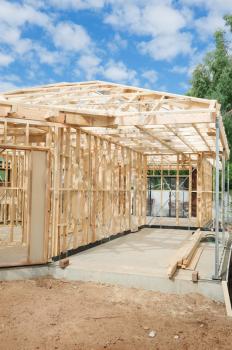 New residential construction home Wooden framing against a blue sky