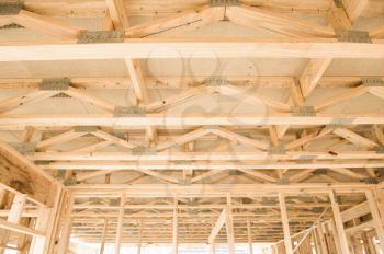 
New residential construction home framing with ceiling view
