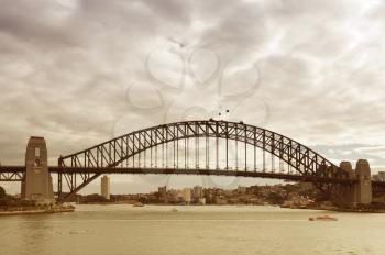 View of the Sydney Harbour Bridge from the sea  in retro style