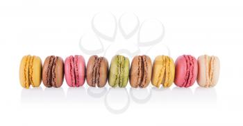Colorful and tasty French Macarons on white background