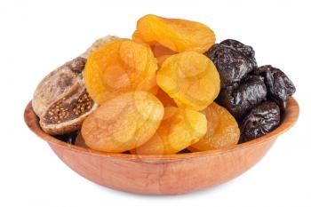 Dried pitted fruits in wooden bowl isolated on  white background