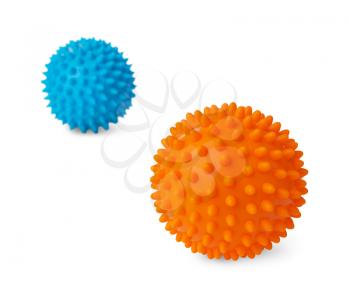 Two spiny plastic orange and blue massage balls isolated on white background.
Focus on the orange ball
