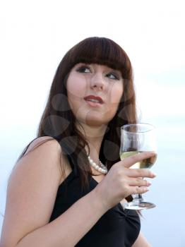 Royalty Free Photo of a Girl With a Glass of White Wine
