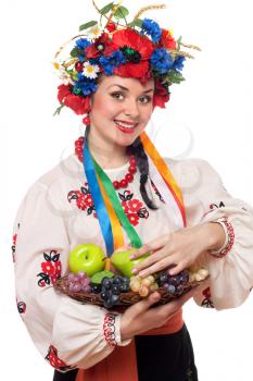 Royalty Free Photo of a Woman in a Traditional Costume With Fruit