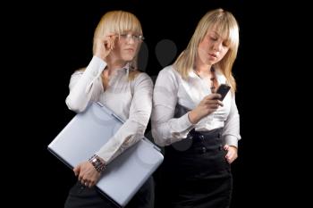 Royalty Free Photo of Two Women With a Laptop and Cellphone