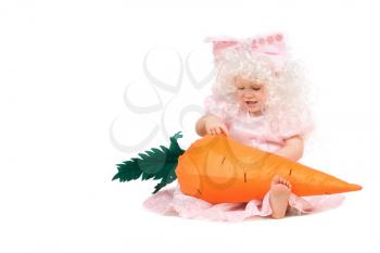 Royalty Free Photo of a Baby in a Costume Holding a Big Carrot