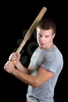 Royalty Free Photo of a Man Holding a Bat