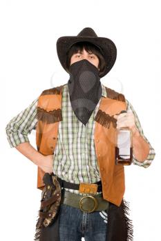 Royalty Free Photo of a Cowboy Holding a Bottle of Whiskey