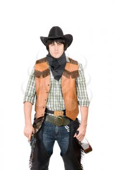 Royalty Free Photo of a Guy Dressed Like a Cowboy Holding a Bottle