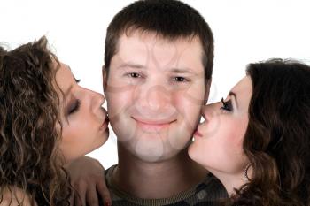 Royalty Free Photo of a Man Being Kissed By Two Women