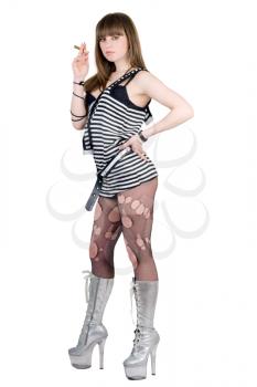 Royalty Free Photo of a Girl in a Striped Dress and High Boots Smoking