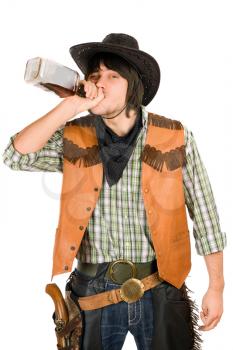 Royalty Free Photo of a Cowboy Drinking Whiskey