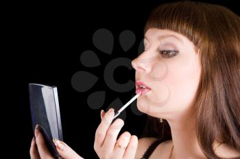 Royalty Free Photo of a Woman Putting on Makeup