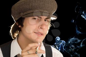 Royalty Free Photo of a Young Man Smoking