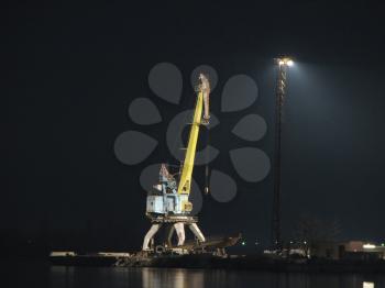 Royalty Free Photo of a Port Crane on the Bank of the Dnieper Night, Ukraine, Zaporozhye