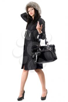 Royalty Free Photo of a Woman in a Coat Carrying a Big Purse