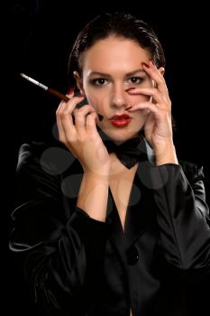 Royalty Free Photo of a Girl with a Cigarette Holder