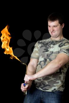 Royalty Free Photo of a Guy With a Gas Torch