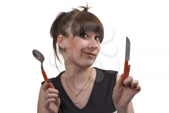 Royalty Free Photo of a Woman With a Knife and a Spoon