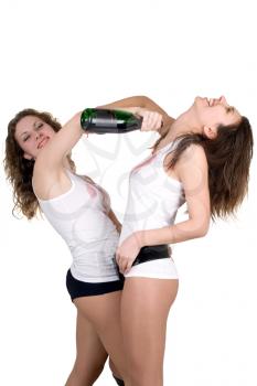 Royalty Free Photo of Two Girls Pouring Wine on Each Other