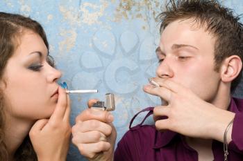 Royalty Free Photo of a Couple Smoking