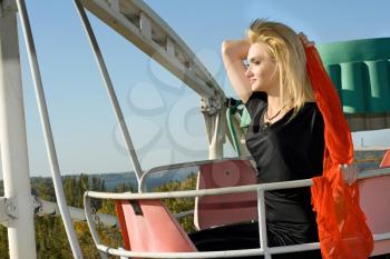 Royalty Free Photo of a Girl Riding a Ferris Wheel