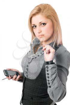 Royalty Free Photo of a Girl Holding Glasses and a Cellphone